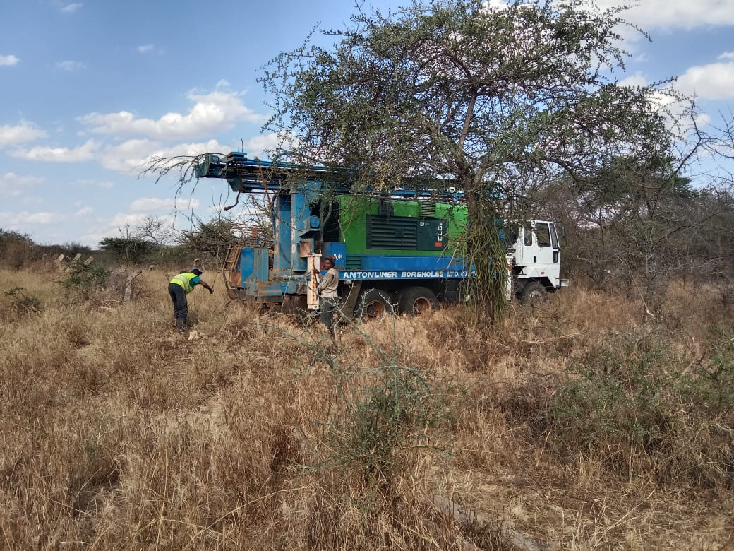 Borehole drilling rig parked and set up on site before drilling begins